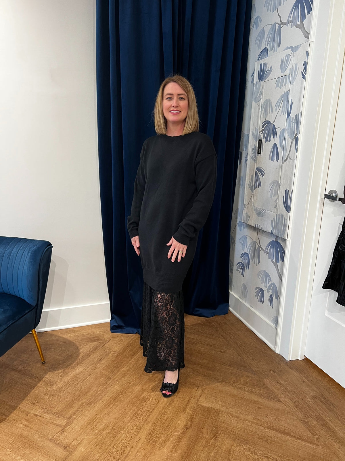 sweater dress with lace trim bottom in black