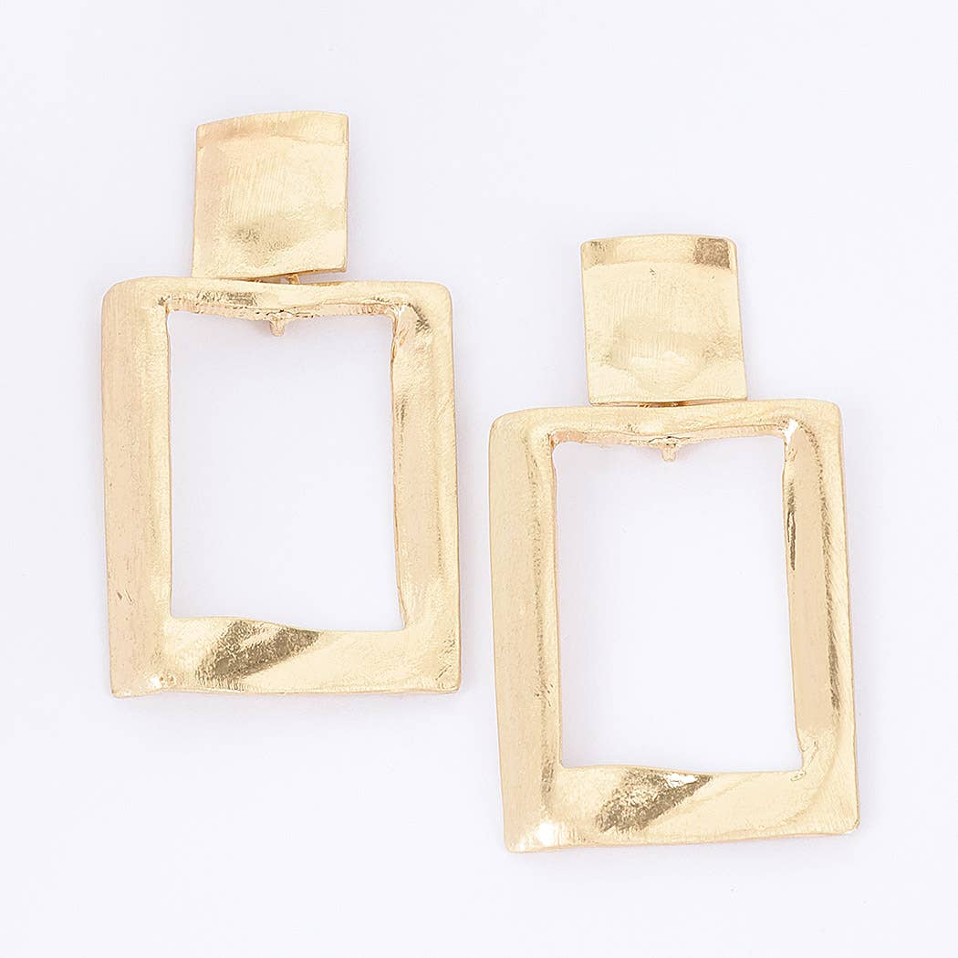 A pair of gold-toned geometric drop earrings with a textured, hammered finish and an open rectangular design, shown on a plain white background.