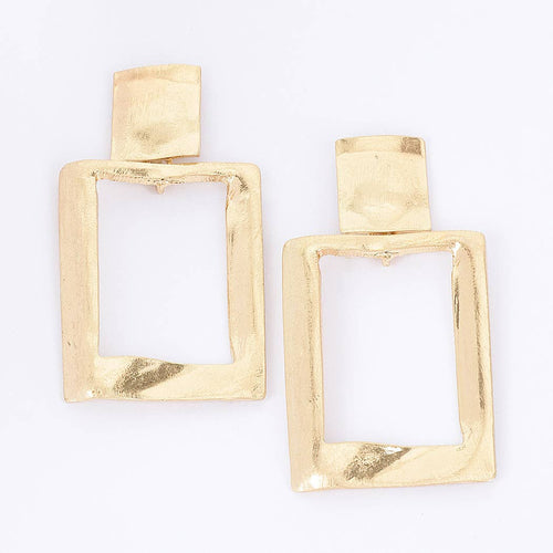 A pair of gold-toned geometric drop earrings with a textured, hammered finish and an open rectangular design, shown on a plain white background.